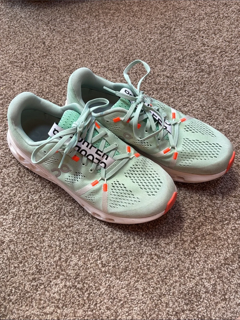 On Running Sneakers in Mint Green with Orange Accents